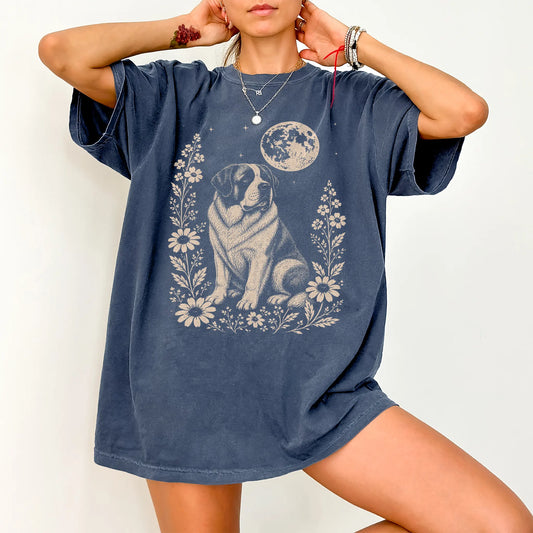 Model wearing a Denim Comfort Colors® T-shirt featuring Saint Bernard framed by flowers beneath the moon