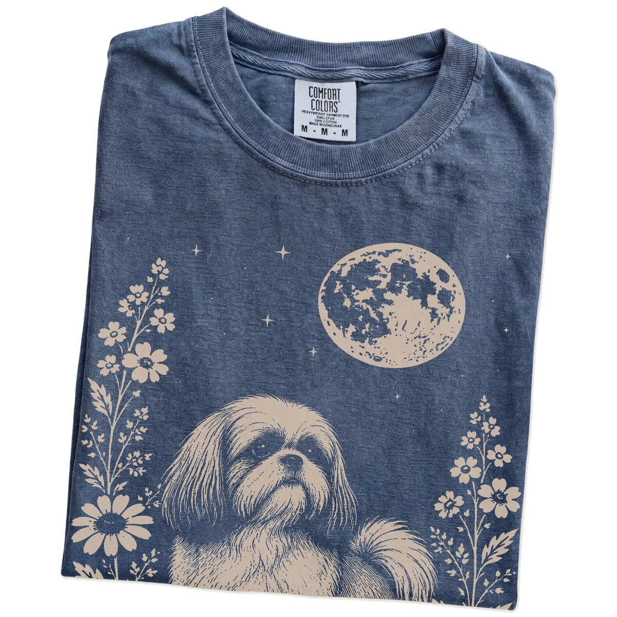 Folded Denim Comfort Colors® T-shirt showing Shih Tzu framed by flowers beneath the moon