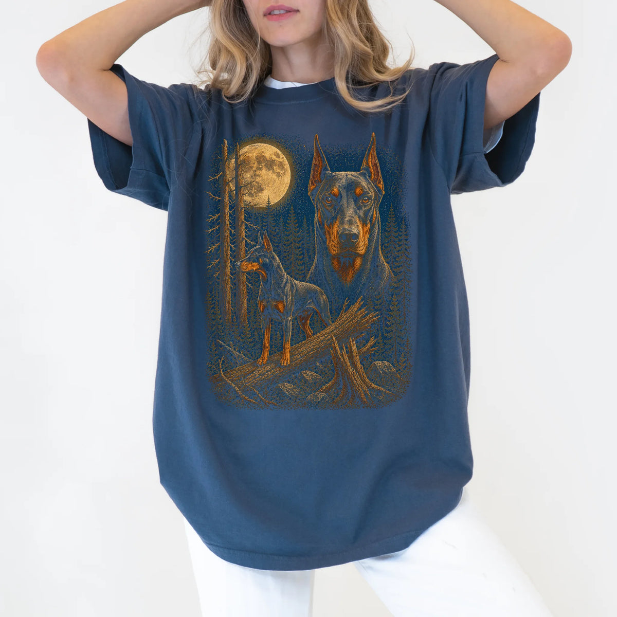 Person wearing a Denim Doberman Wildwood Moon t-shirt