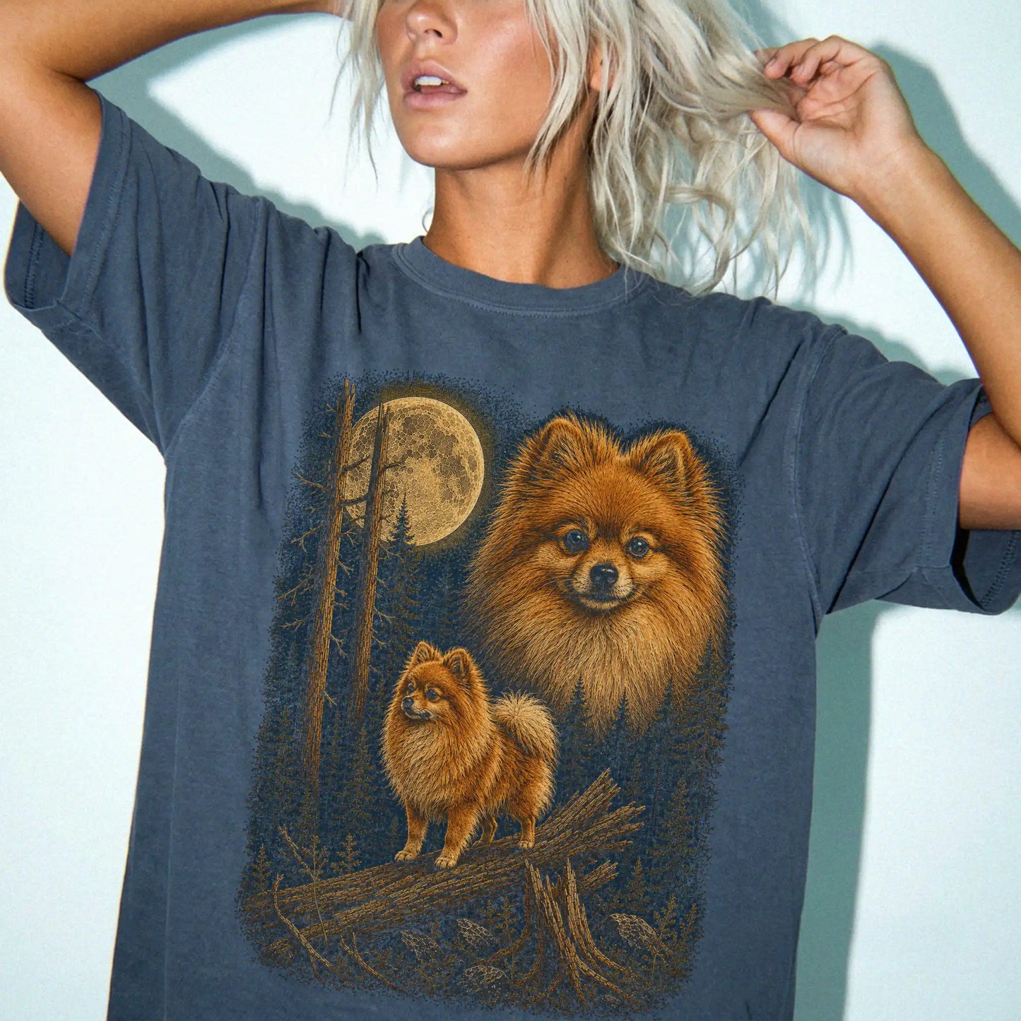 Person wearing a Denim Pomeranian full-color Moonlit Forest t-shirt