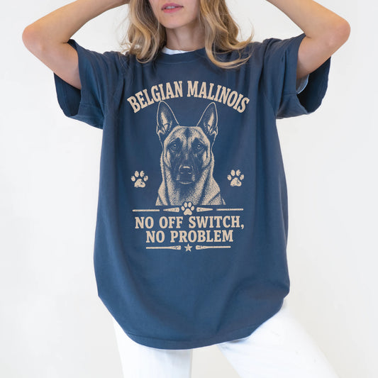 Model wearing a Denim Comfort Colors® T-shirt featuring Belgian Malinois design with “No Off Switch, No Problem” lettering
