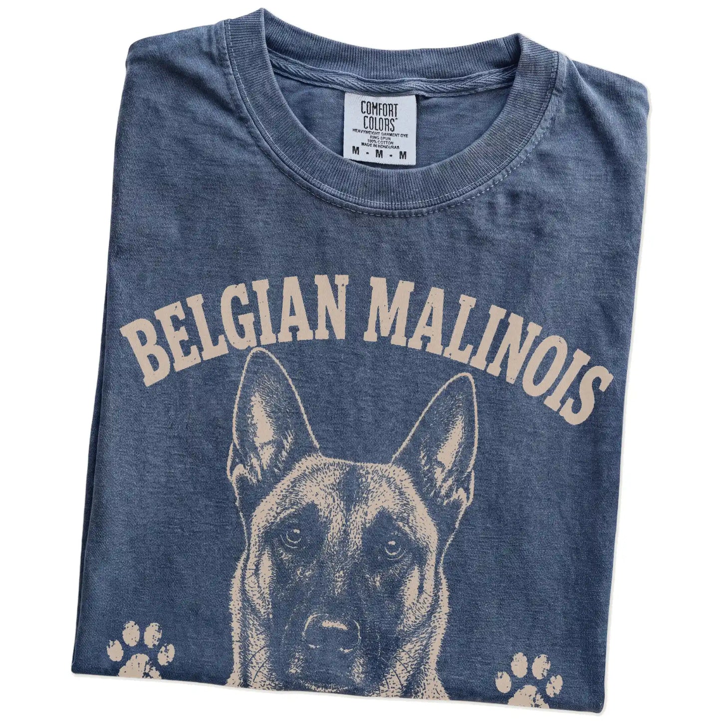 Folded Denim Comfort Colors® T-shirt showing Belgian Malinois design with “No Off Switch, No Problem” lettering
