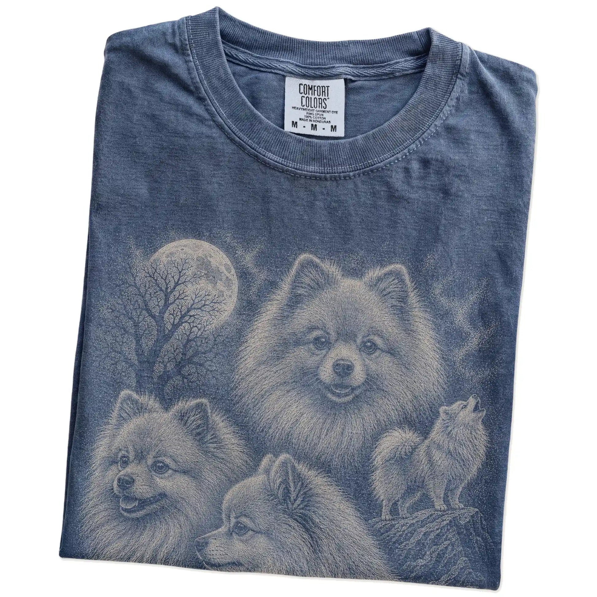Folded Denim Comfort Colors® T-shirt showing a vintage moon montage featuring Pomeranian