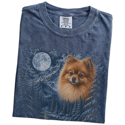Folded denim T-shirt with Pomeranian Winter Moon artwork.