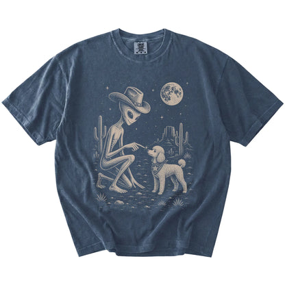 Cowboy alien fist-bumping a Poodle beneath the moon on a Denim Comfort Colors® T-shirt