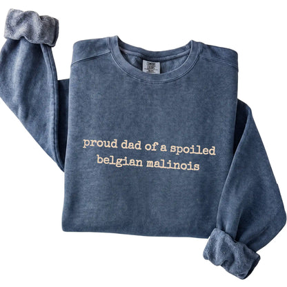 Denim Proud Dad of a Spoiled Belgian Malinois Comfort Colors sweatshirt folded to show the printed design