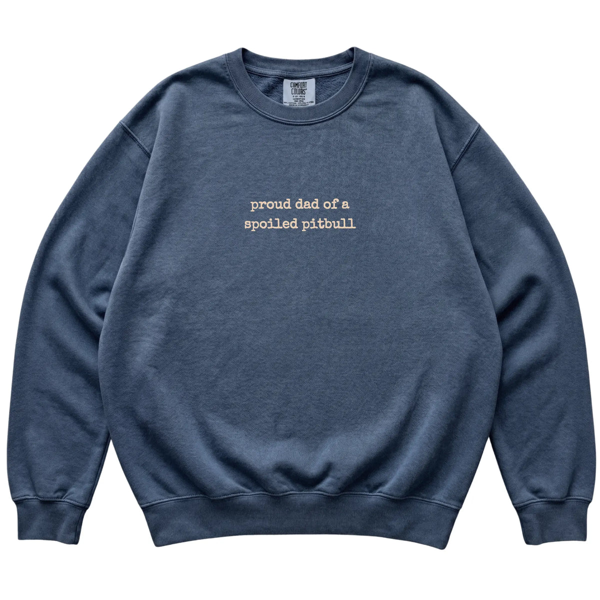 Denim Proud Dad of a Spoiled Pitbull Comfort Colors sweatshirt laid flat