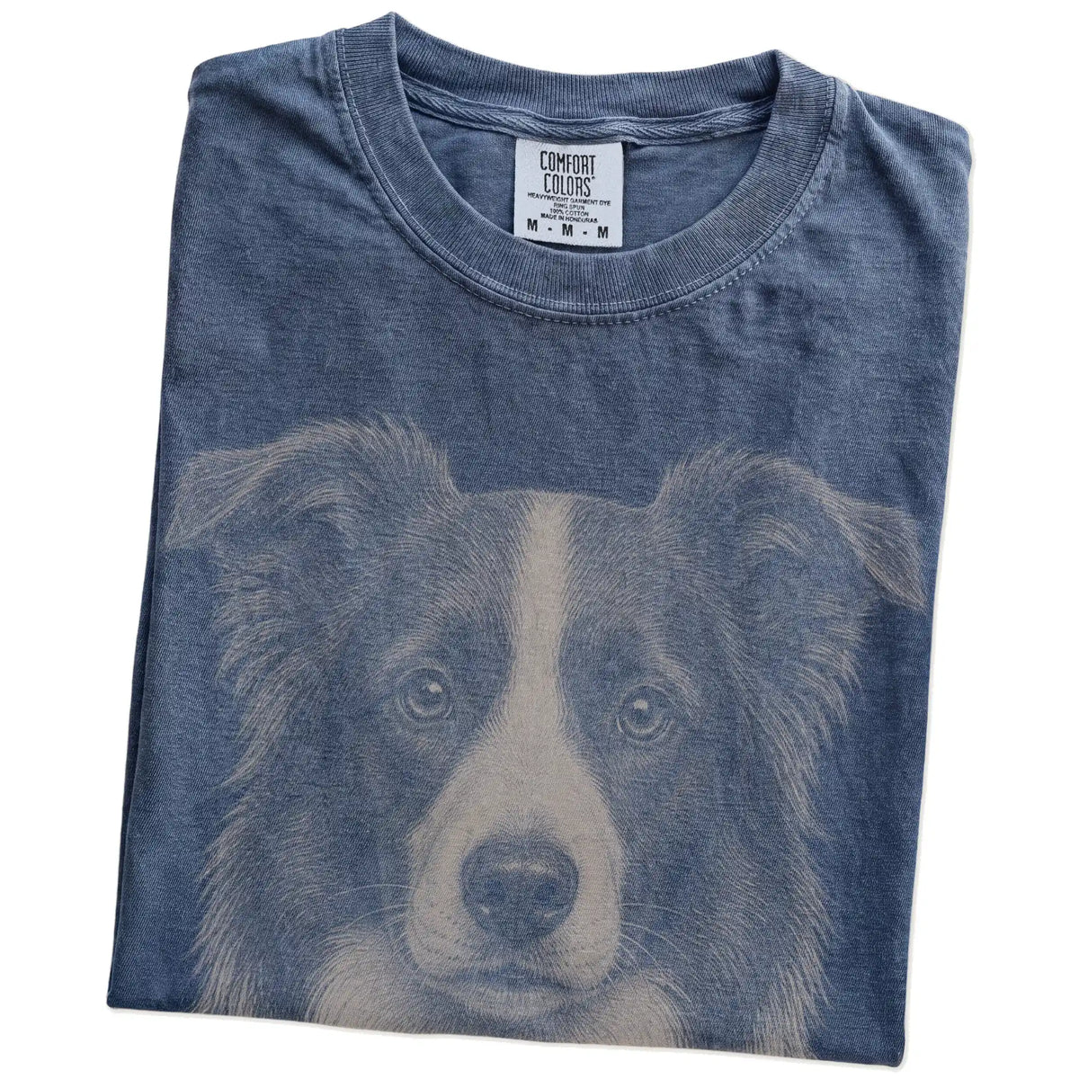 Folded Denim Comfort Colors® T-shirt showing a realistic drawing of a Border Collie