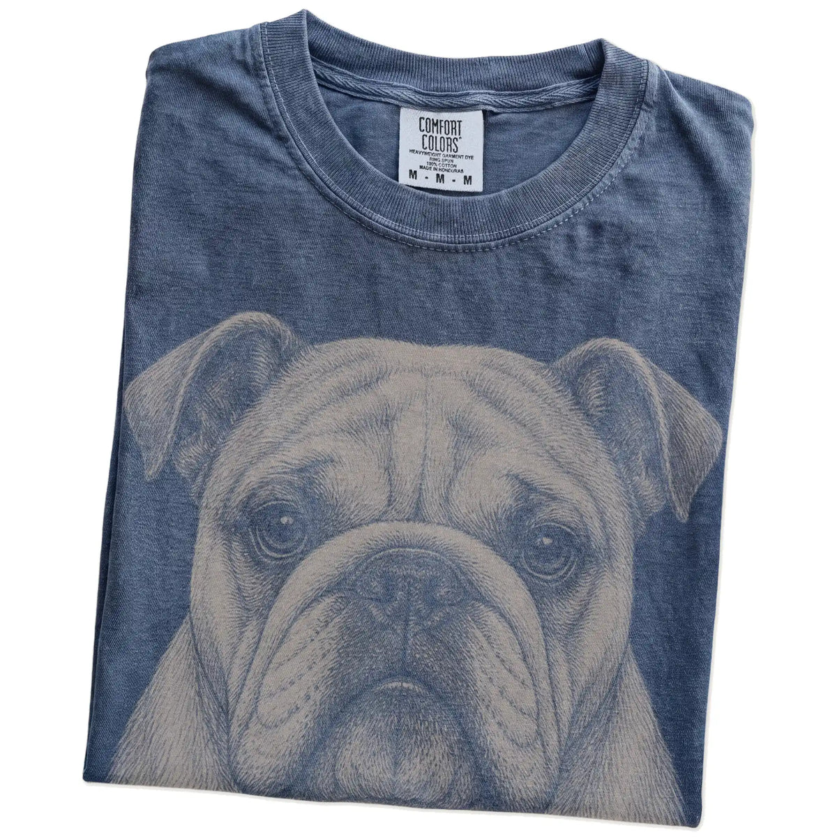 Folded Denim Comfort Colors® T-shirt showing a realistic drawing of a Bulldog