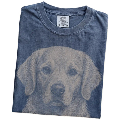 Folded Denim Comfort Colors® T-shirt showing a realistic drawing of a Golden Retriever