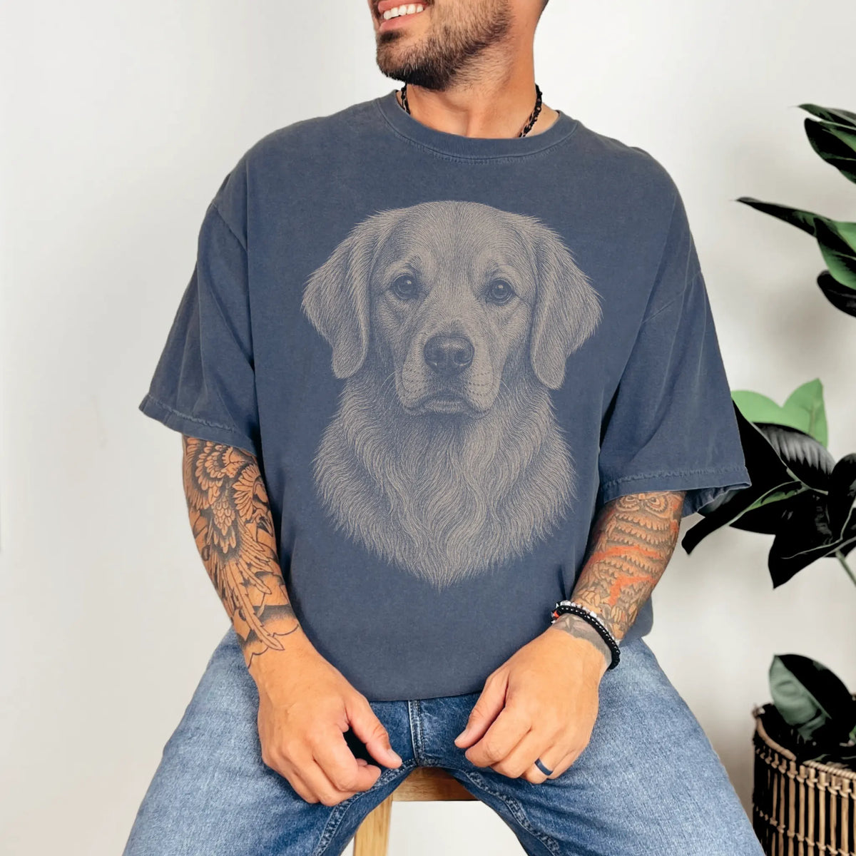 Model wearing a Denim Comfort Colors® T-shirt with a realistic drawing of a Golden Retriever