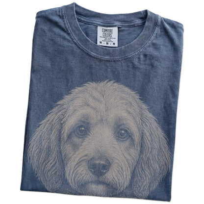 Folded Denim Comfort Colors® T-shirt showing a realistic drawing of a Labradoodle
