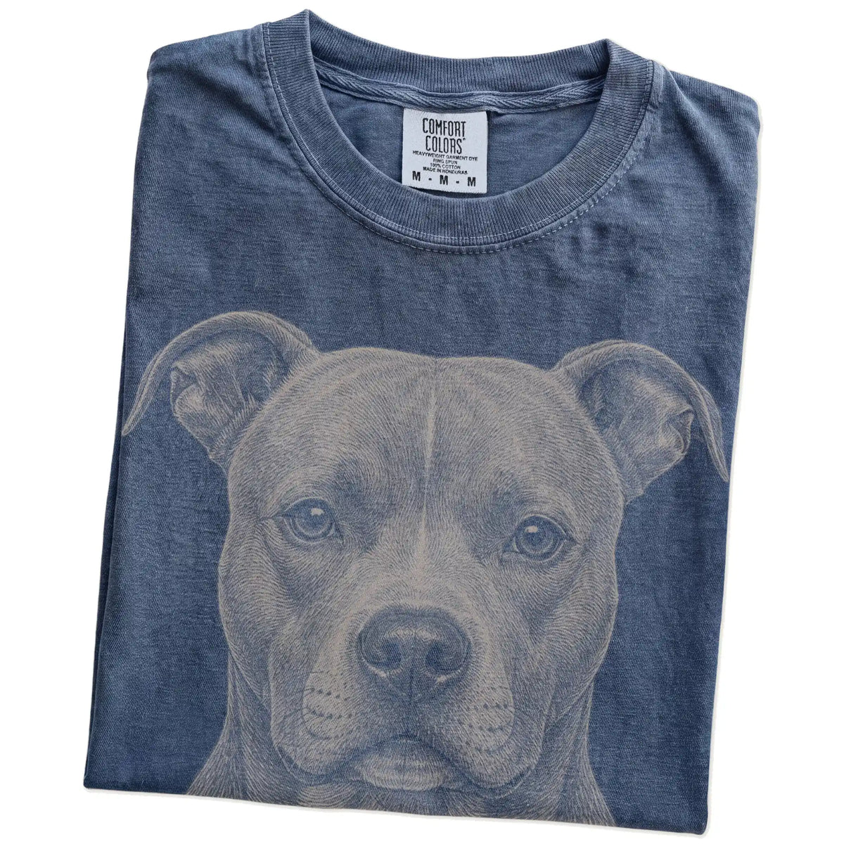 Folded Denim Comfort Colors® T-shirt showing a realistic drawing of a Pitbull