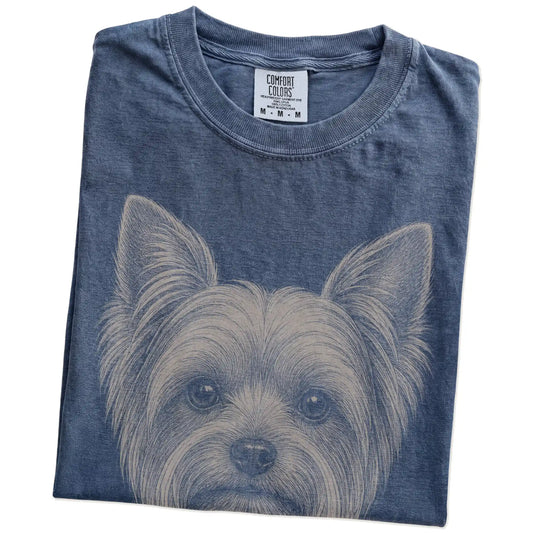 Folded Denim Comfort Colors® T-shirt showing a realistic drawing of a Yorkie