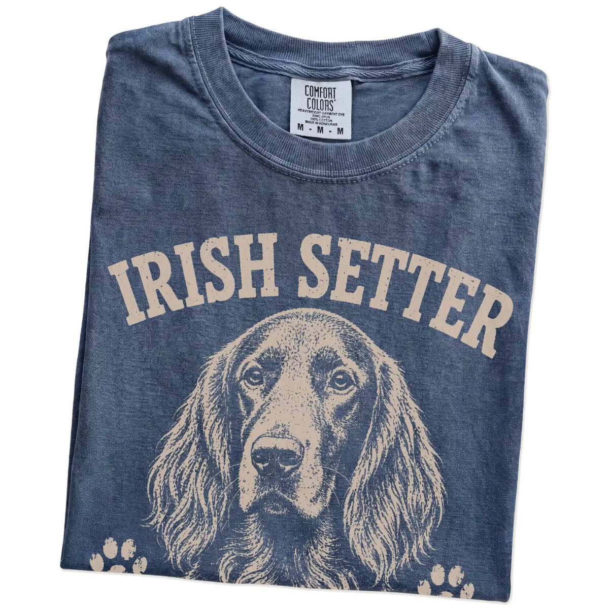 Folded Denim Comfort Colors® T-shirt showing Irish Setter design with “Red Hair, Don't Care” lettering