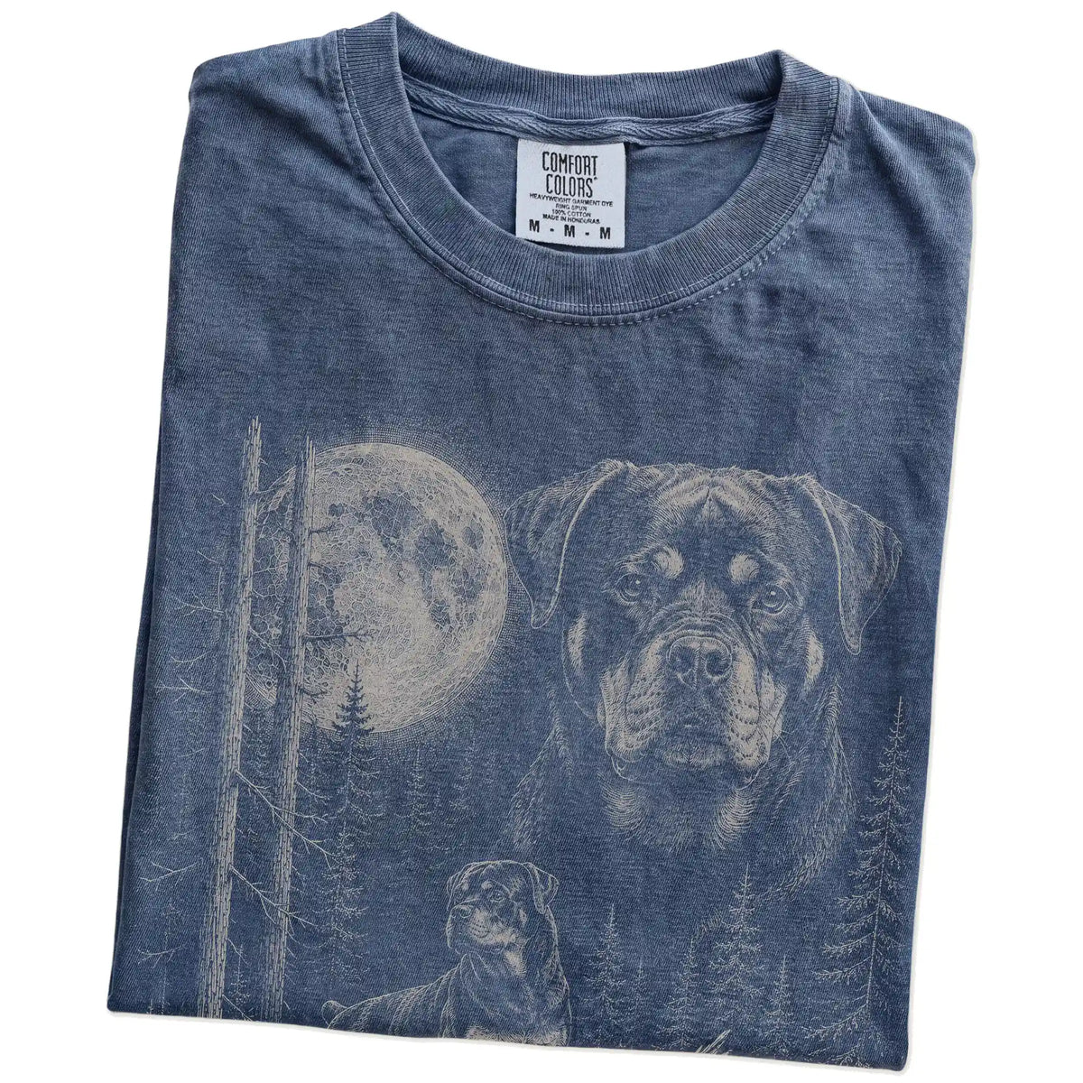 Folded Denim Rottweiler Moonlit Forest T-Shirt showing the graphic
