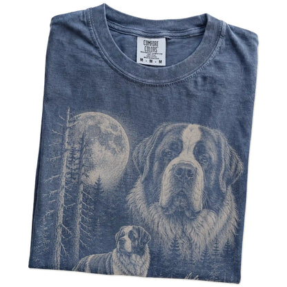 Folded Denim Saint Bernard Moonlit Forest T-Shirt showing the graphic