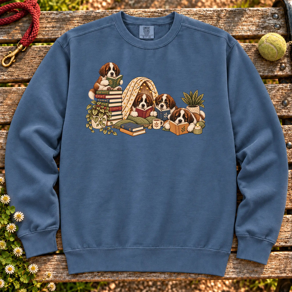 Saint Bernard puppies reading books in a cozy blanket fort on a Denim sweatshirt