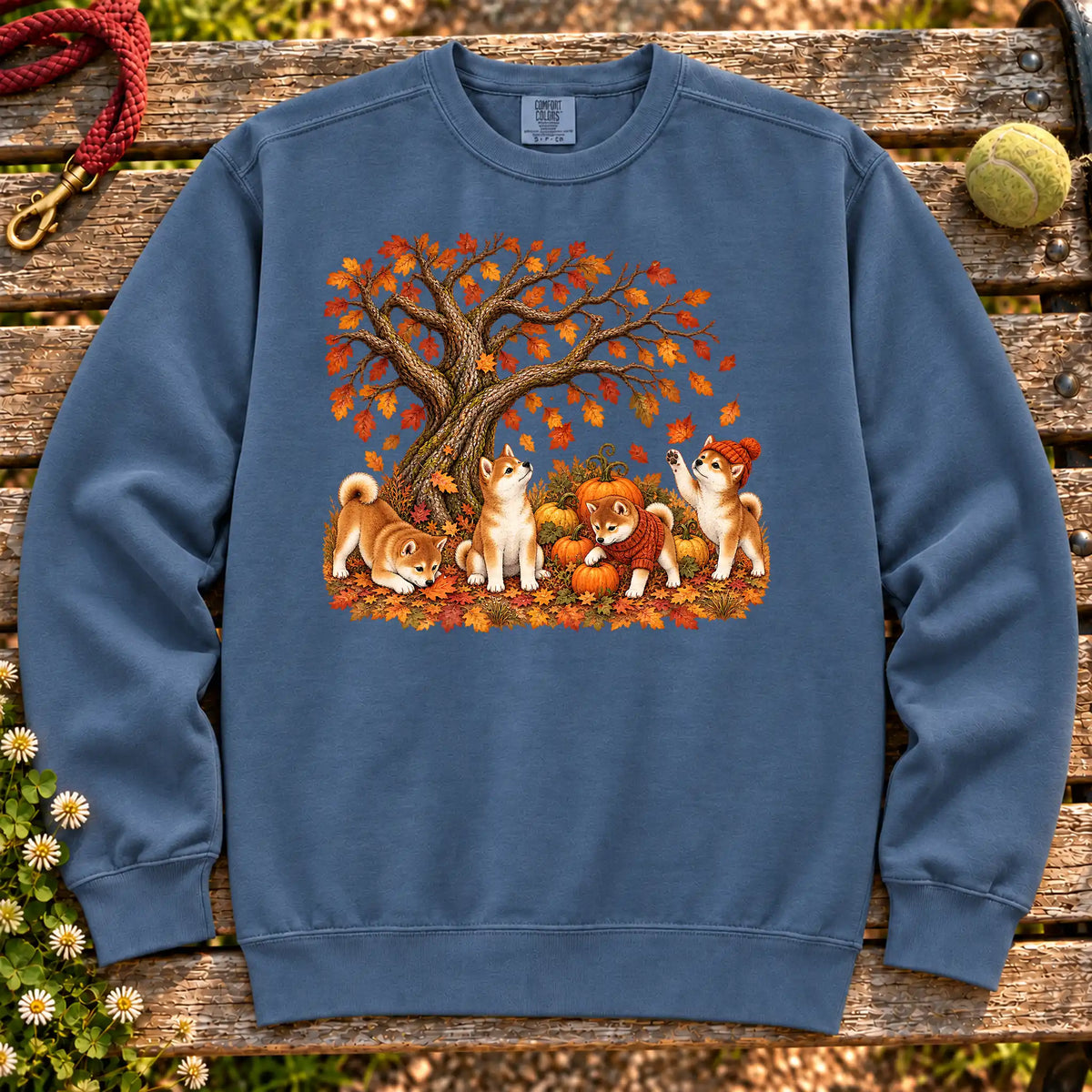Four Shiba Inu puppies with pumpkins beneath an autumn tree on a Denim garment-dyed sweatshirt