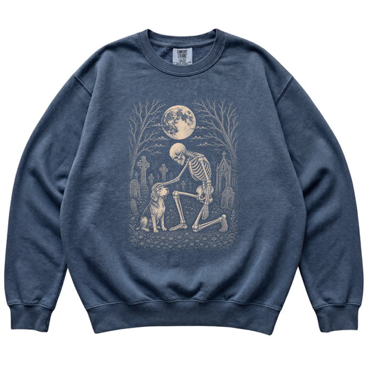 Skeleton petting a Beagle in a graveyard on a Denim sweatshirt