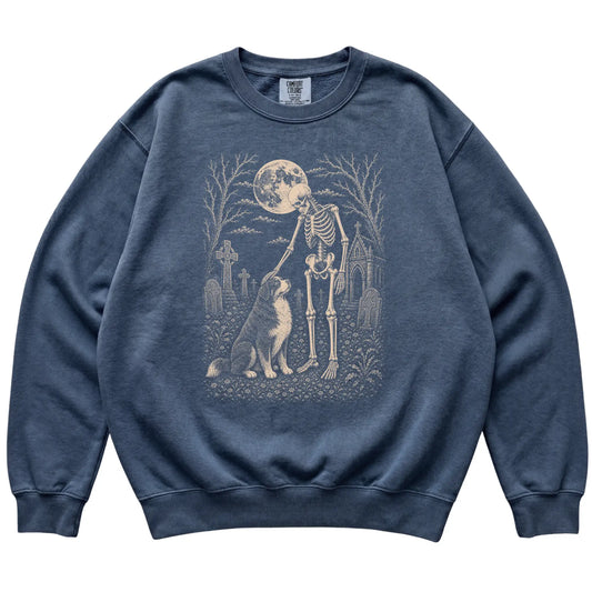 Skeleton petting a Bernese Mountain Dog in a graveyard on a Denim sweatshirt
