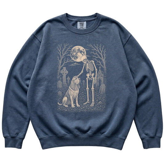 Skeleton petting a Bloodhound in a graveyard on a Denim sweatshirt
