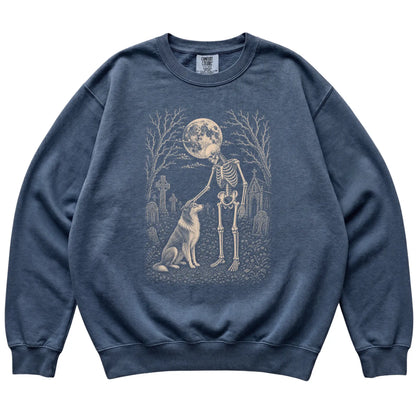 Skeleton petting a Collie in a graveyard on a Denim sweatshirt