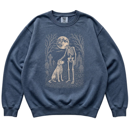 Skeleton petting a Labrador Retriever in a graveyard on a Denim sweatshirt