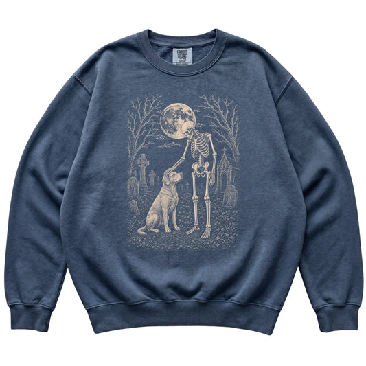 Skeleton petting a Labrador Retriever in a graveyard on a Denim sweatshirt