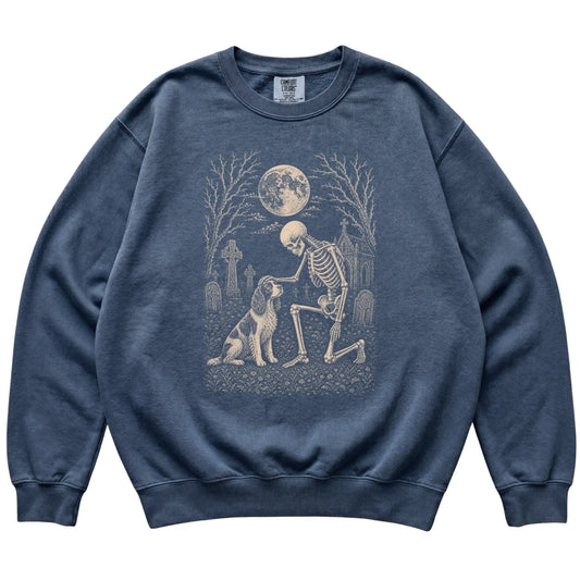 Skeleton petting a Springer Spaniel in a graveyard on a Denim sweatshirt