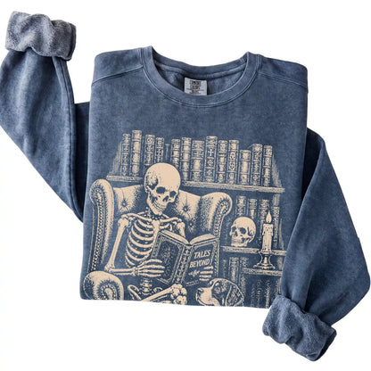 Folded Denim sweatshirt with a skeleton reading Tales Beyond to a Bernese Mountain Dog