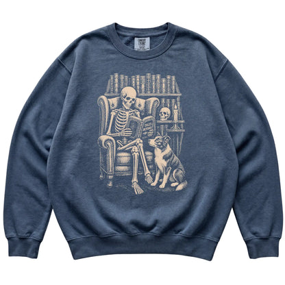 Skeleton reading Tales Beyond to a Border Collie on a Denim sweatshirt