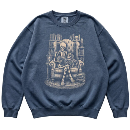 Skeleton reading Tales Beyond to a Dachshund on a Denim sweatshirt