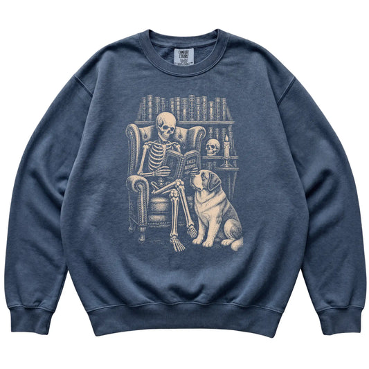Skeleton reading Tales Beyond to a Saint Bernard on a Denim sweatshirt