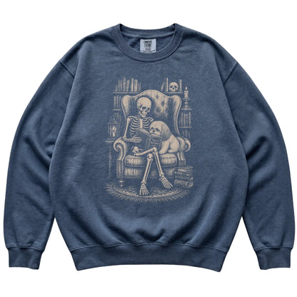 Skeleton reading Tales Beyond to a Shih Tzu on a Denim sweatshirt