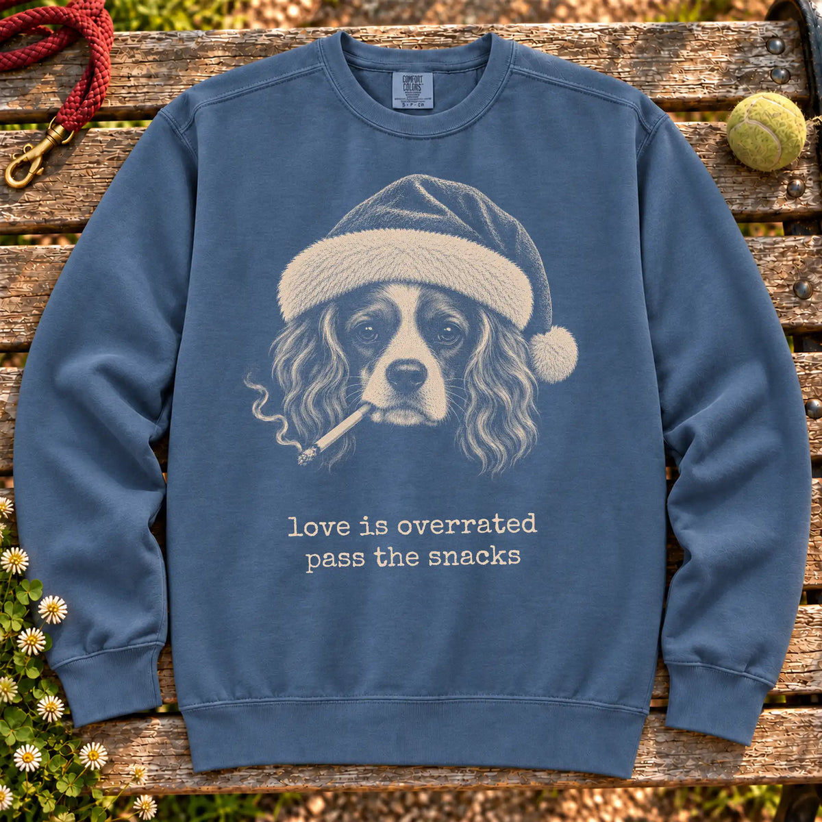 Cavalier King Charles Spaniel wearing a Santa hat and smoking on a Denim sweatshirt