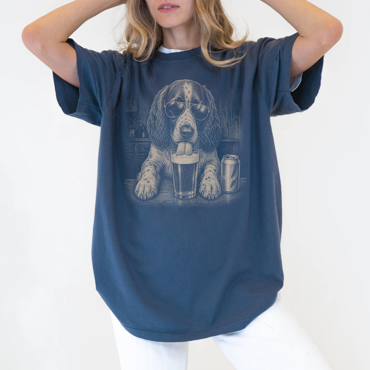 Model wearing a Denim Comfort Colors® t-shirt with Springer Spaniel sneaking a drink from a pint
