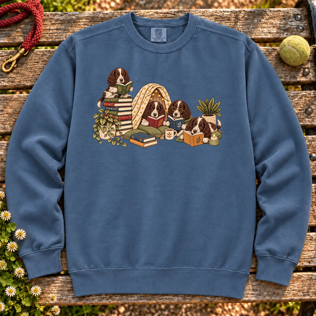 Springer Spaniel puppies reading books in a cozy blanket fort on a Denim sweatshirt