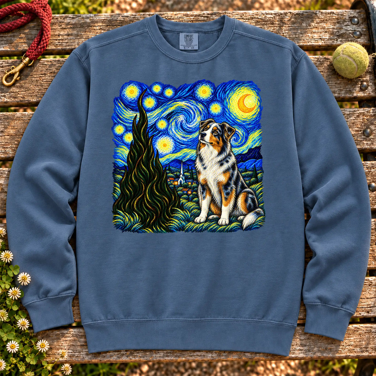 Colorful Australian Shepherd beneath a swirling starry night sky on a Denim sweatshirt