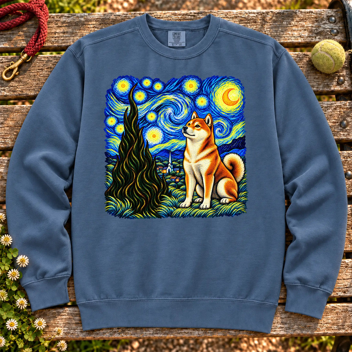 Colorful Shiba Inu beneath a swirling starry night sky on a Denim sweatshirt
