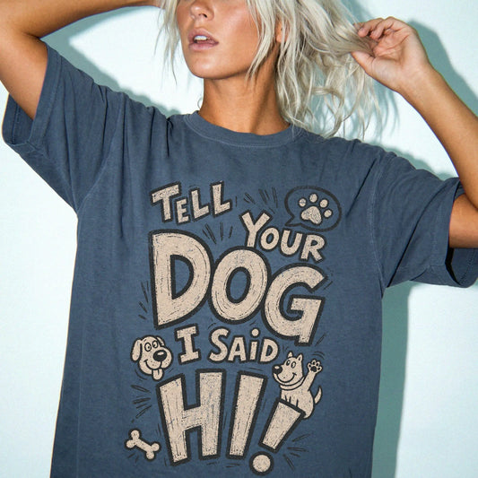 Model wearing a Denim Comfort Colors® T-shirt with tell your dog i said hi lettering