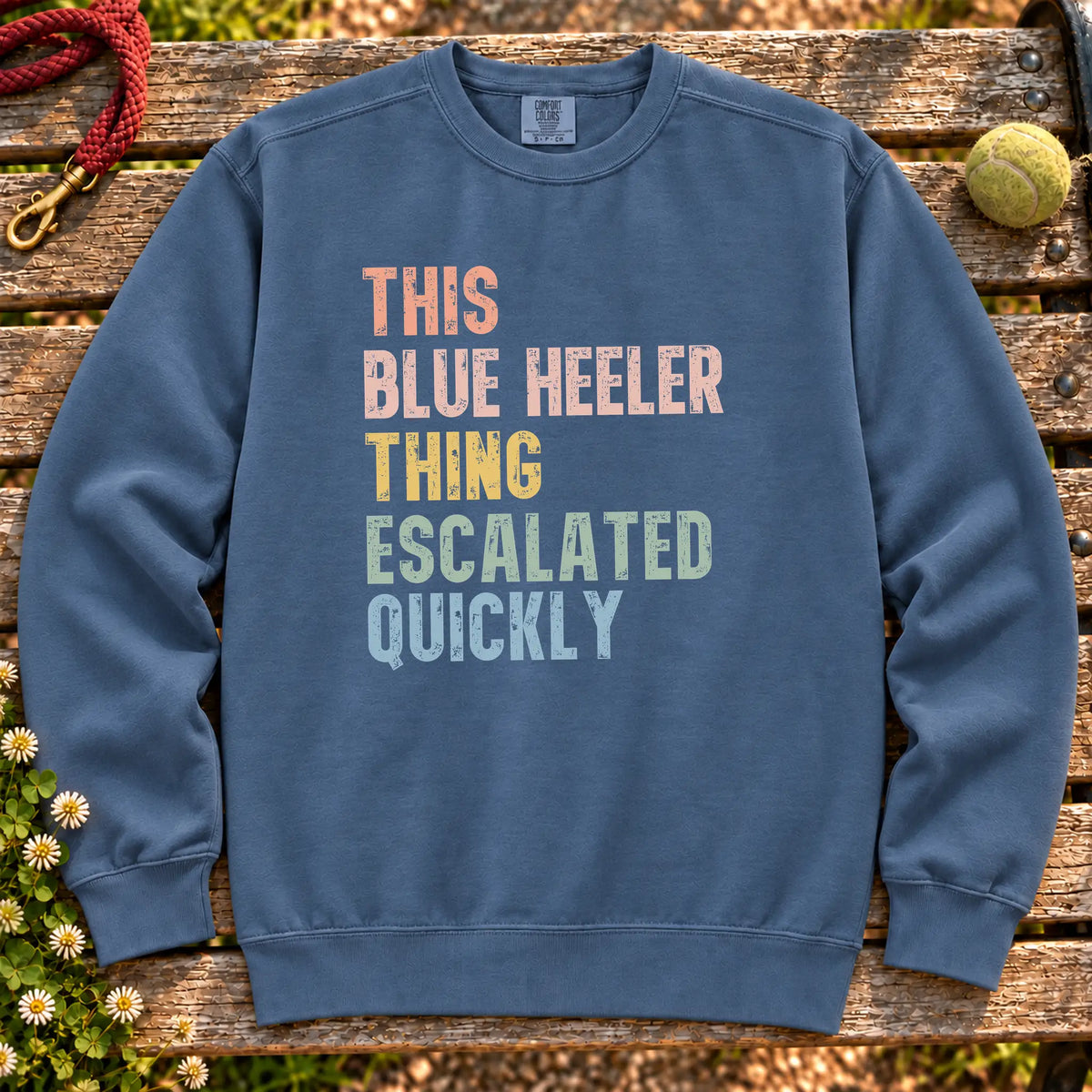 “This Blue Heeler thing escalated quickly” text on a Denim sweatshirt