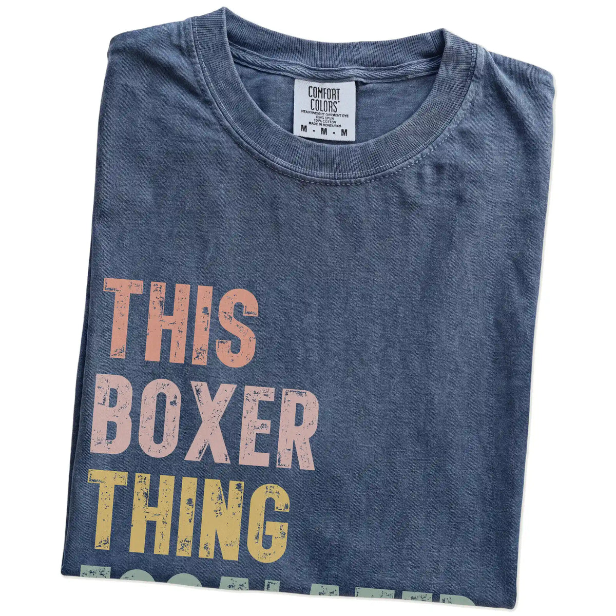 Folded Denim Comfort Colors® T-shirt showing retro “This Boxer Thing Escalated Quickly” lettering