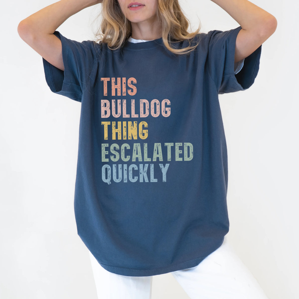 Model wearing a Denim Comfort Colors® T-shirt with retro “This Bulldog Thing Escalated Quickly” lettering