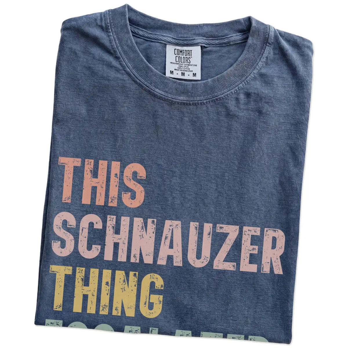 Folded Denim Comfort Colors® T-shirt showing retro “This Schnauzer Thing Escalated Quickly” lettering