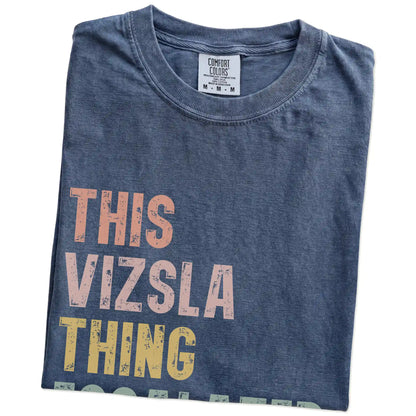 Folded Denim Comfort Colors® T-shirt showing retro “This Vizsla Thing Escalated Quickly” lettering