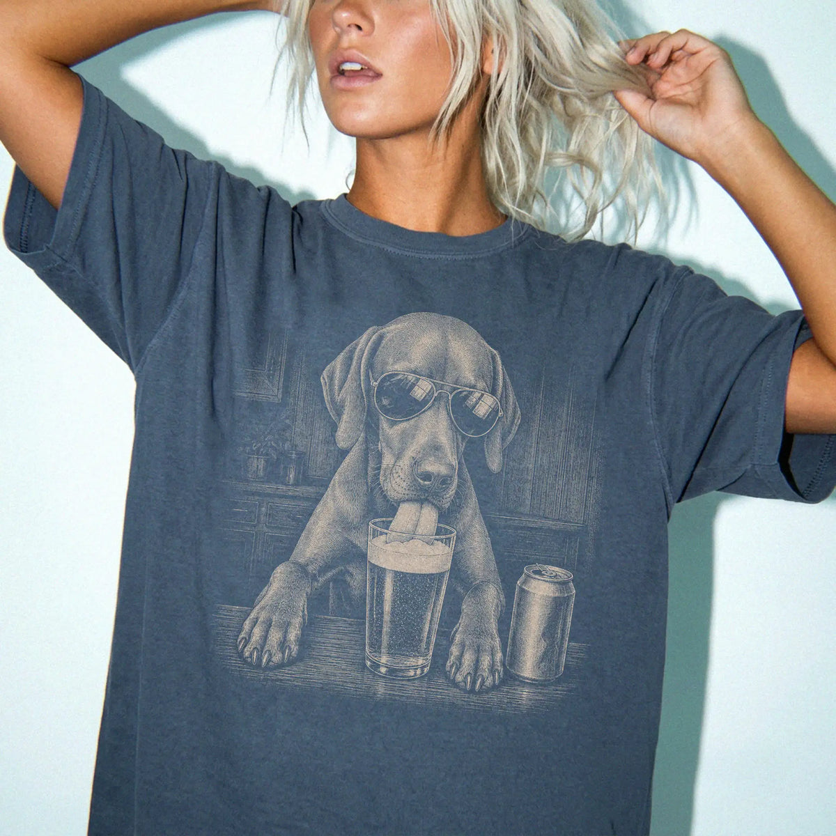 Model wearing a Denim Comfort Colors® t-shirt with Vizsla sneaking a drink from a pint