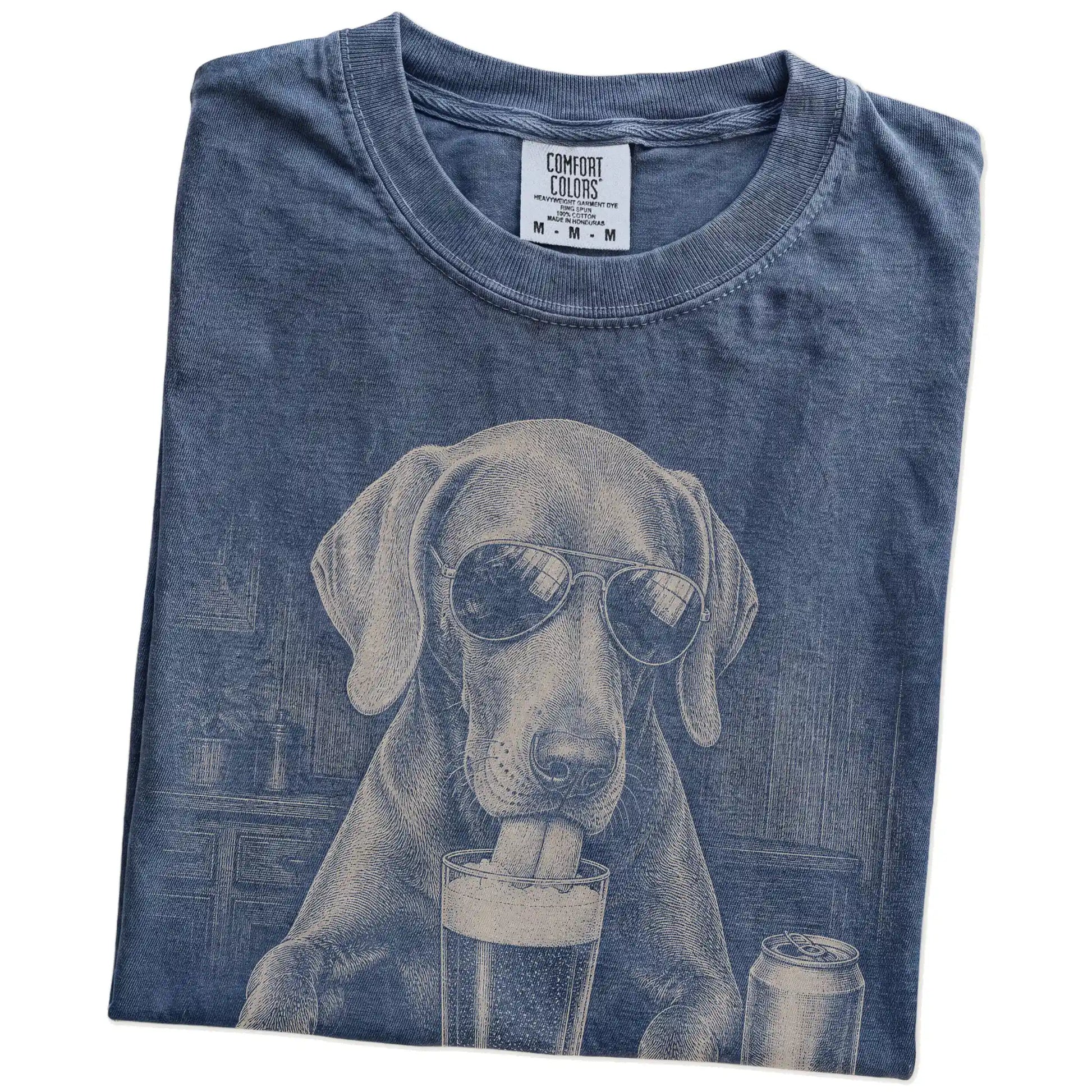 Folded Denim Comfort Colors® t-shirt showing Weimaraner sneaking a drink from a pint