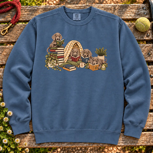 Weimaraner puppies reading books in a cozy blanket fort on a Denim sweatshirt