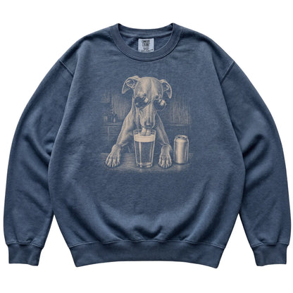 Denim Whippet drinking from a pint at a bar, laid flat